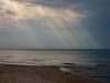 Sonnenstrahlen am Meer
